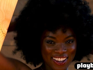 Curly ebony MILF model dancing naked