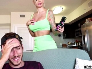 Teasing bigtitted tattooed MILF strokes big white cock
