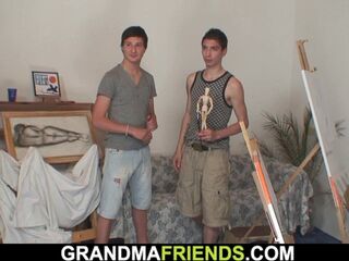 Youthful fellows penetrate naked elderly gal from both sides