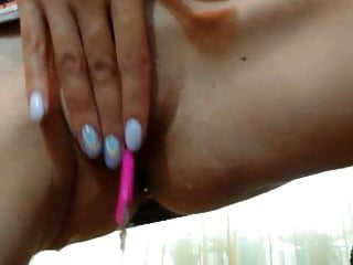 Mommy fingering at home in the kitchen on camera.