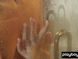 Sexy blonde muse teasing in the shower