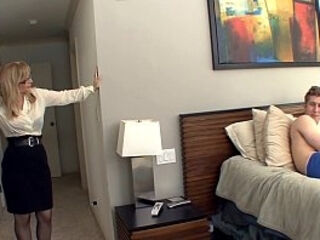 Big boobed blonde milf in stockings and a garter